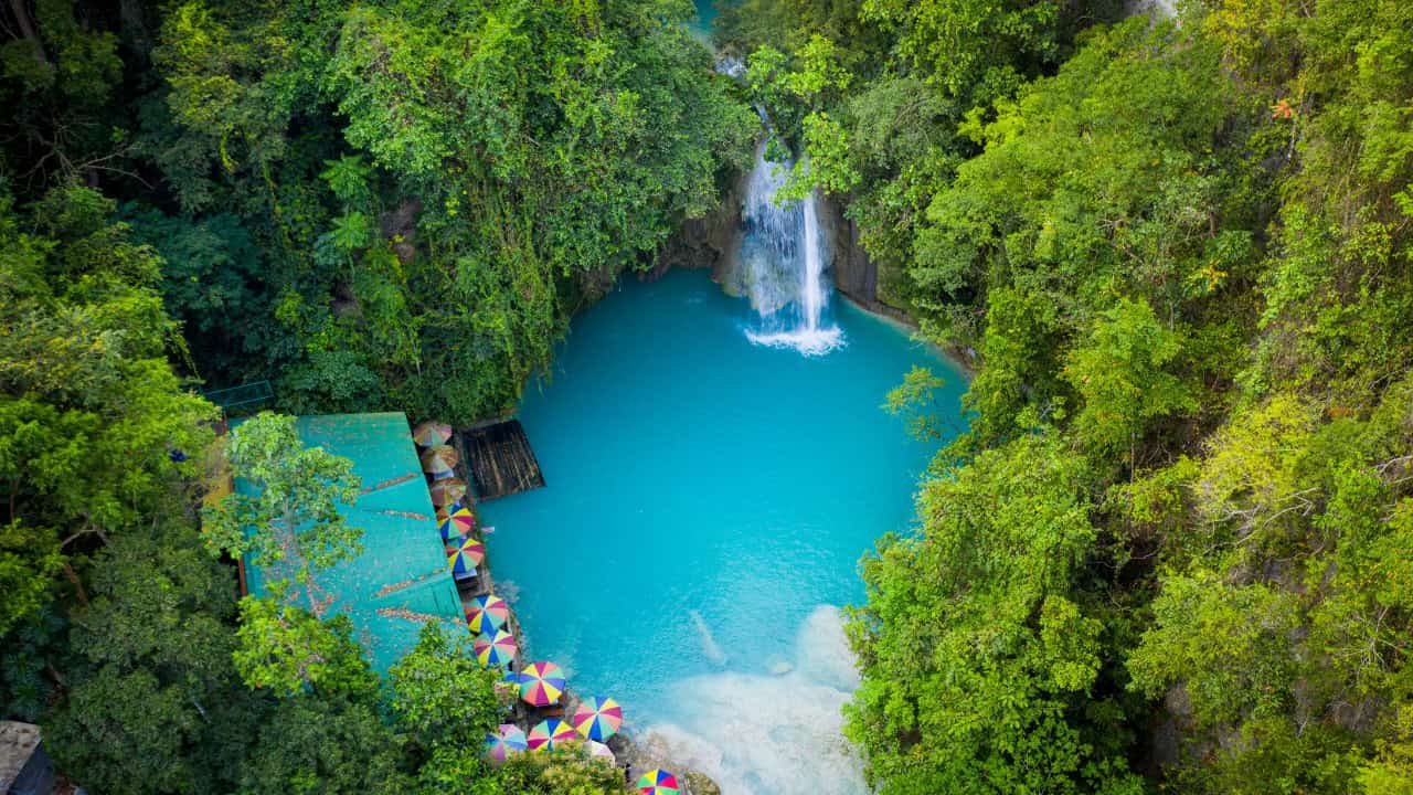 things to do in dumaguete - Things to Do in Dumaguete: A Traveler’s Guide to the City of Gentle People Canyoneer at Kawasan Falls in Badian.