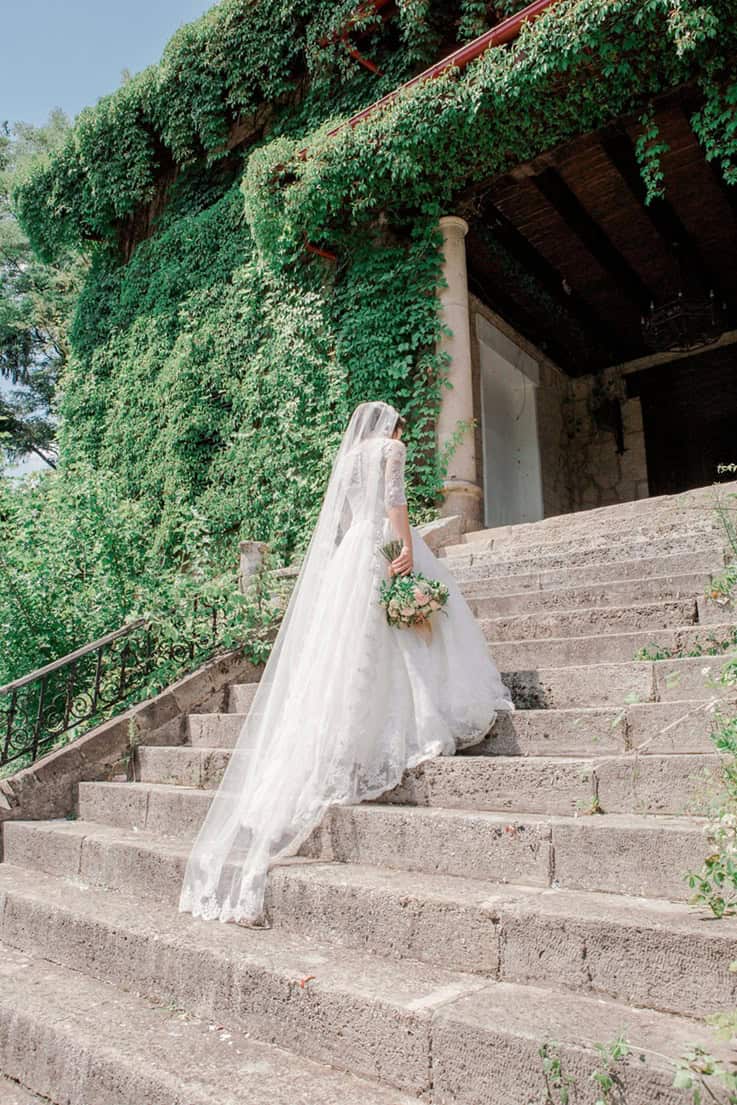 destination wedding - How to Choose the Right Destination Wedding Location (When Everyone Tells You Something Different) A bride ascends a staircase.