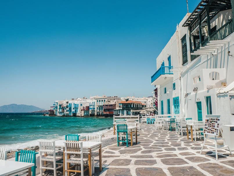 visiting greece - Visiting Greece: Good Things To Know and Common Phrases Greek restaurant at the sea's edge.