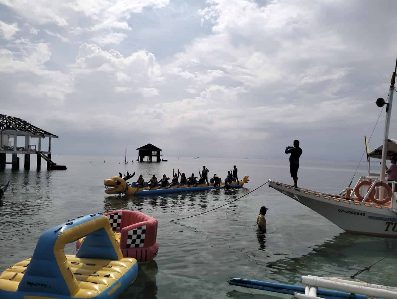 things to do in dumaguete - Things to Do in Dumaguete: A Traveler’s Guide to the City of Gentle People People boating at Manjuyod Sandbar.