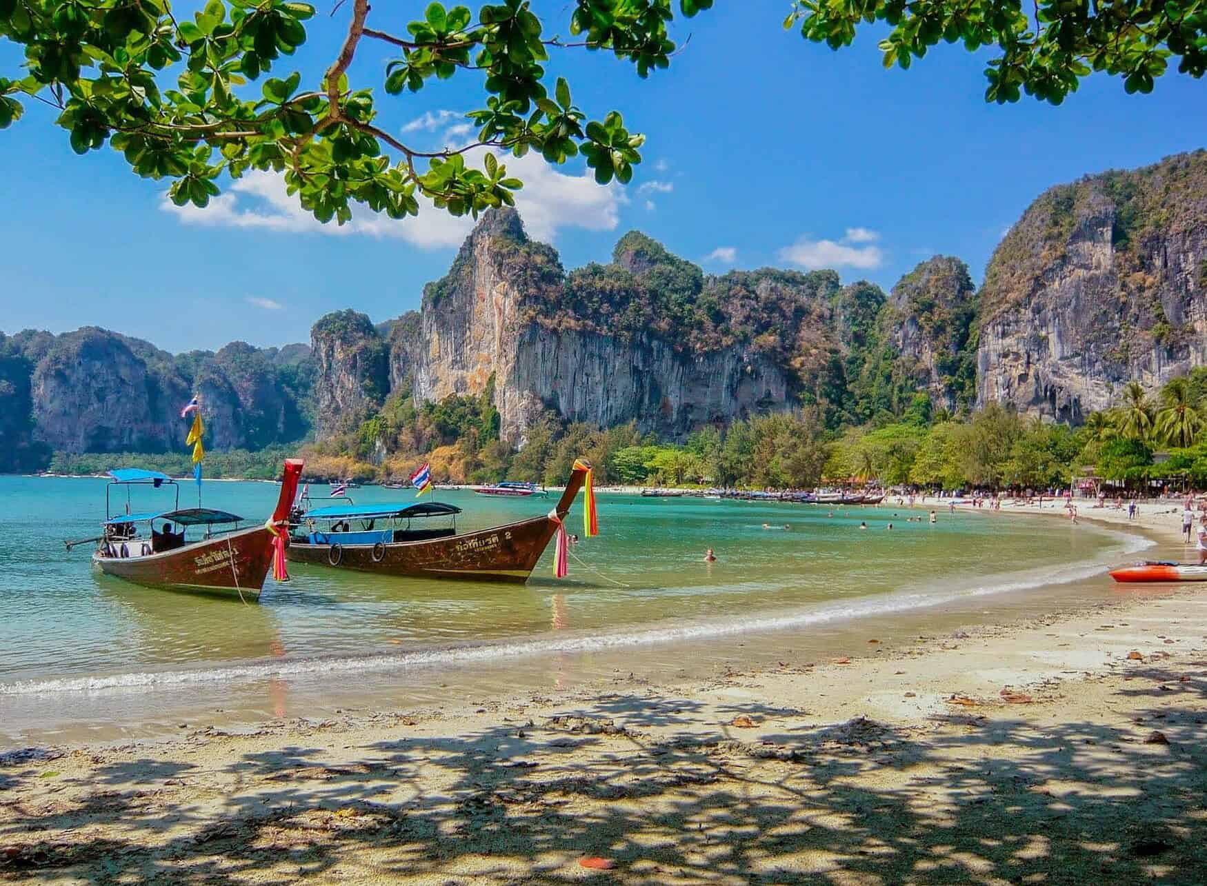 wed in thailand - Top Reasons to Wed in Thailand’s Paradise Longtail boats at the beach in Thailand.