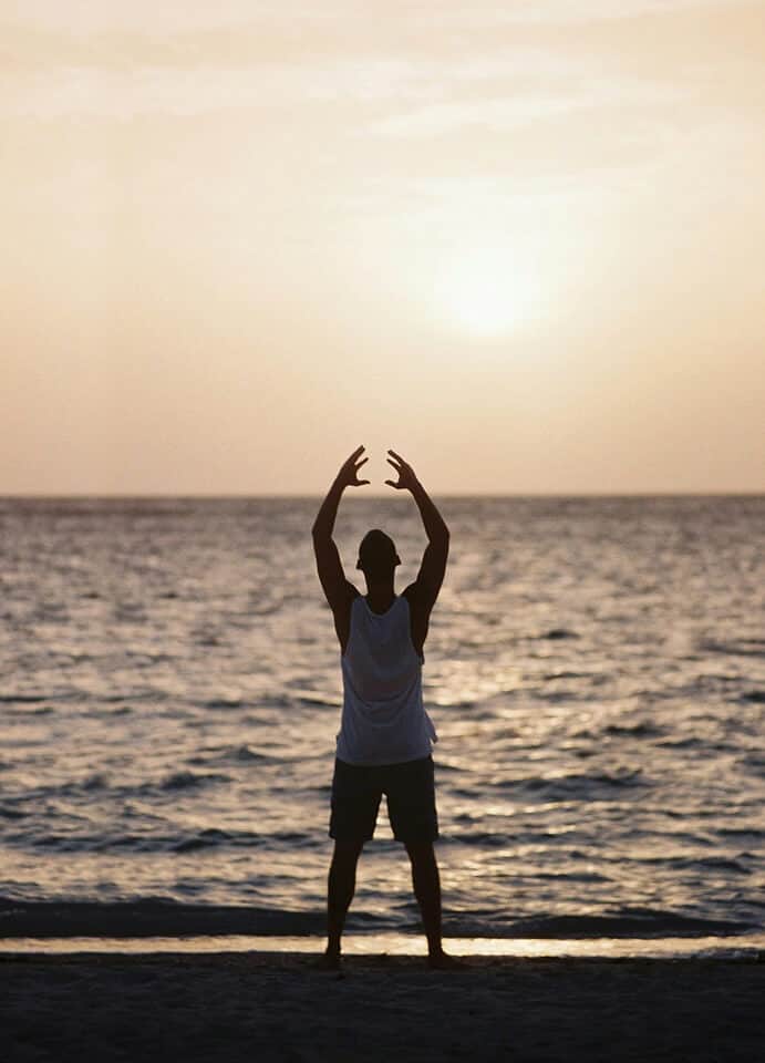yoga retreat in the galapagos islands - Time For A Yoga Retreat in the Galapagos Islands? A person practising yoga on the beach