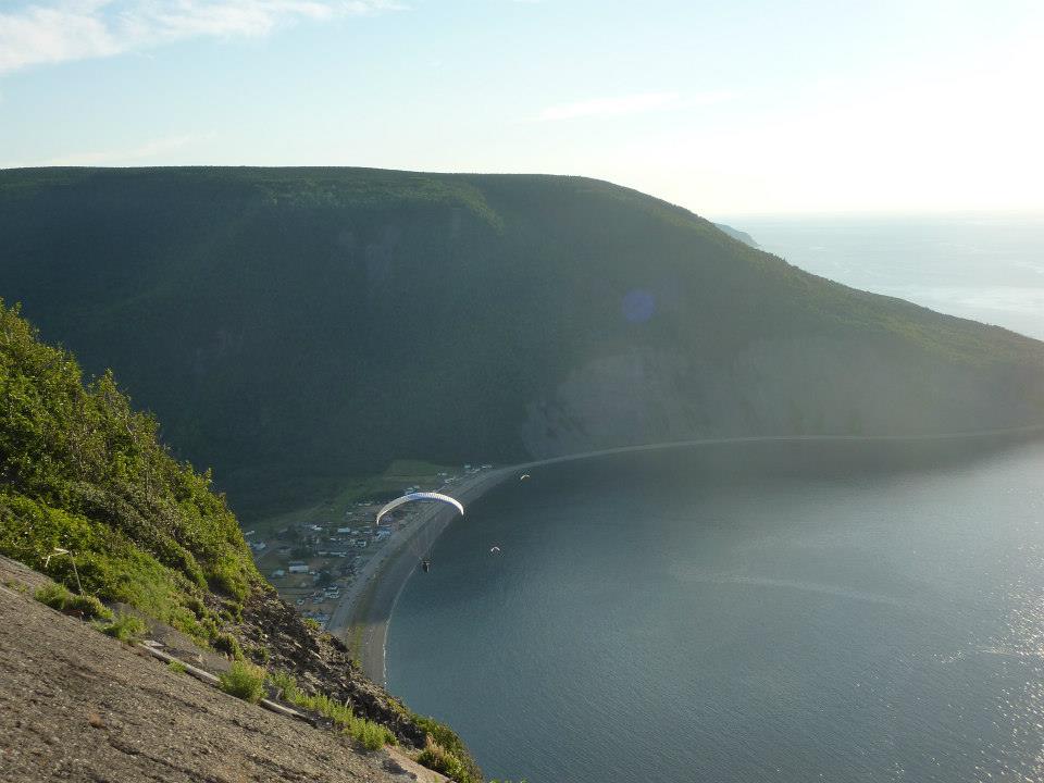 - Guide to Exploring Québec’s Maritime Regions: An Epic Road Trip Paragliding at Station de montagne sur mer de Mont-Saint-Pierre in Quebéc, Canada.