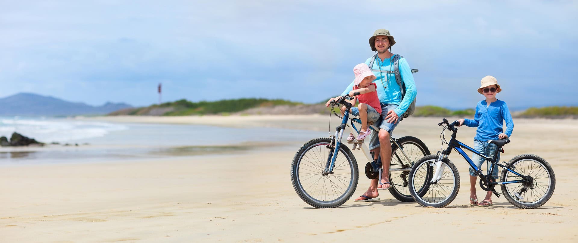 - How to Travel Sustainably in the Galapagos Islands Riding the bicycle on the beach at the Galapagos Isalnds, Ecuador.