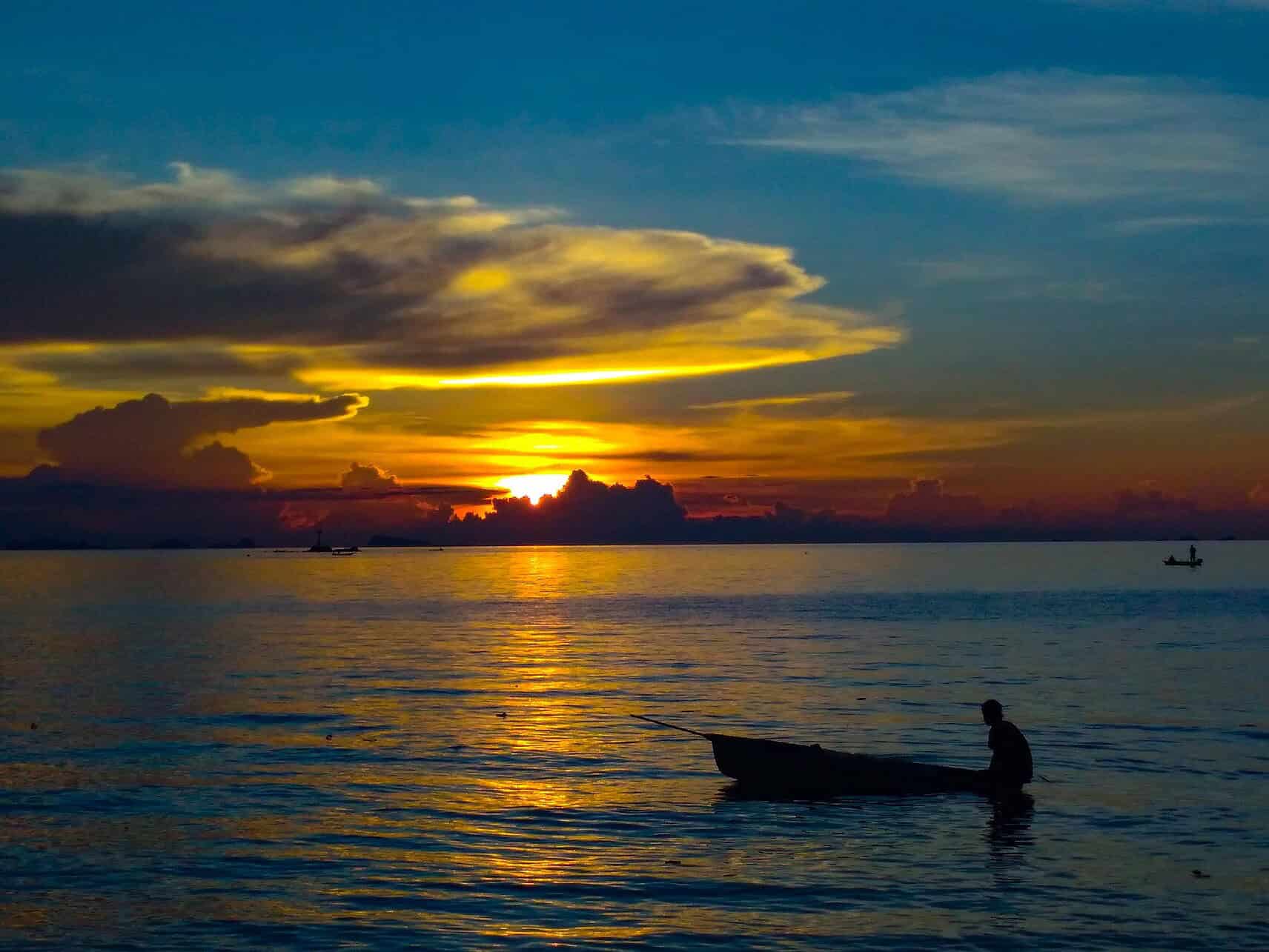 wed in thailand - Top Reasons to Wed in Thailand’s Paradise Sunset silhouette in Koh Phangan, Thailand.
