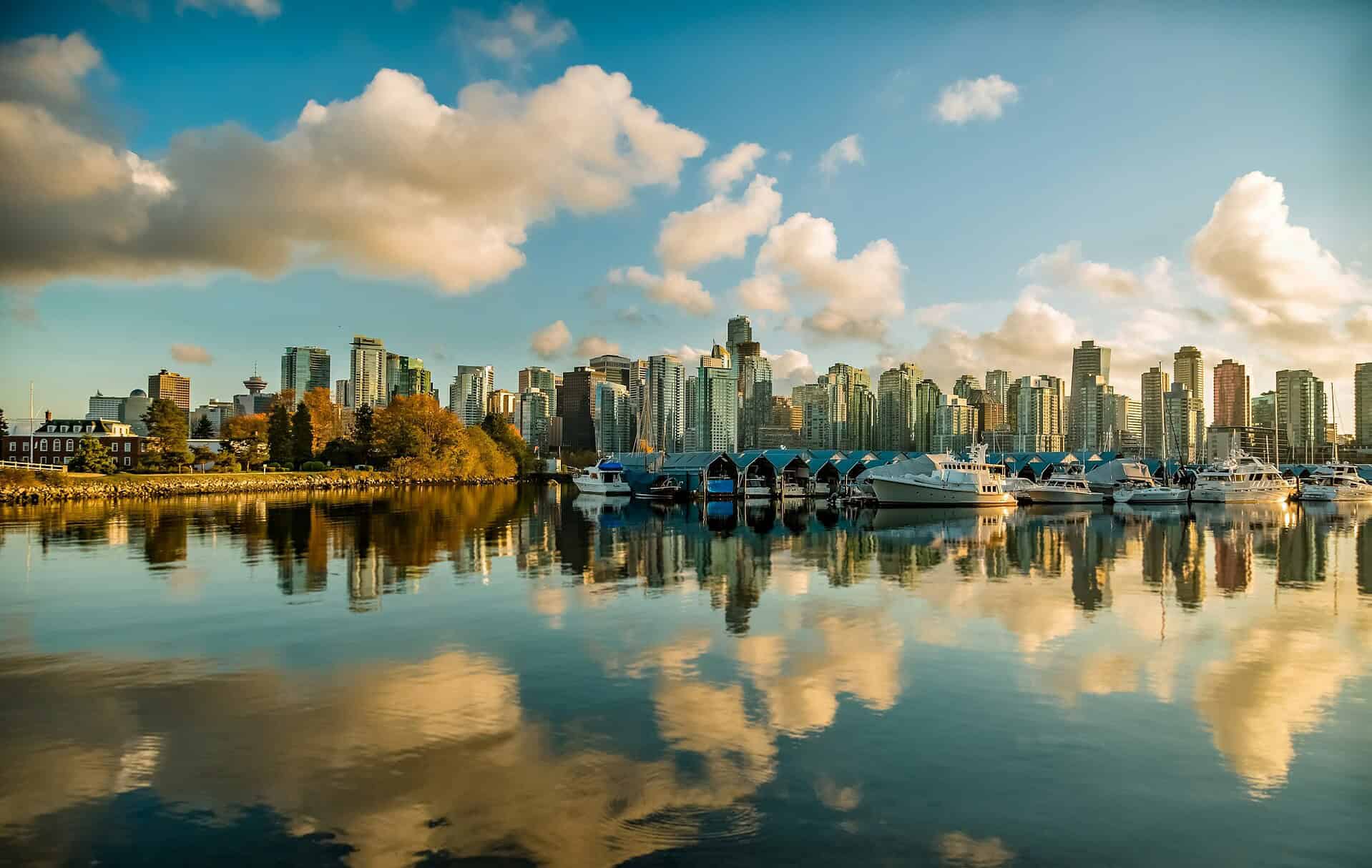 most accessible cities - The Most Accessible Cities in the World A distant wide shot of the reflective water bordering Vancouver, Canada.